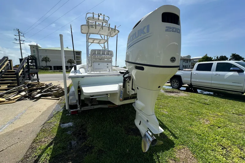 Slide: The Image of 2021 C-Hawk 23 Center Console boat with Suzuki 200 engine on trailer. - 7
