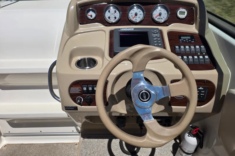 Slide: The Image of 2007 Chaparral Signature 250 dashboard with steering wheel and control panel. - 10