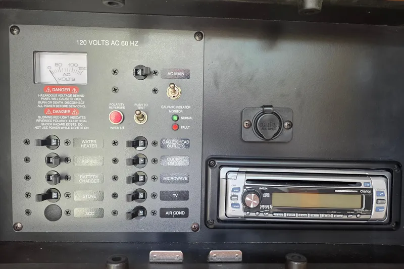 Slide: The Image of Electrical control panel and stereo system on a 2007 Chaparral Signature 250 boat. - 17