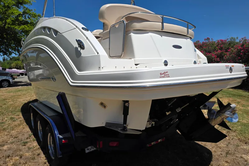 Slide: The Image of 2007 Chaparral Signature 250 boat on trailer, rear view, parked on grass. - 6