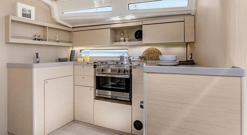 Slide: The Image of Modern kitchen interior of 2026 Beneteau Oceanis 40.1 yacht with sleek cabinetry and appliances. - 5