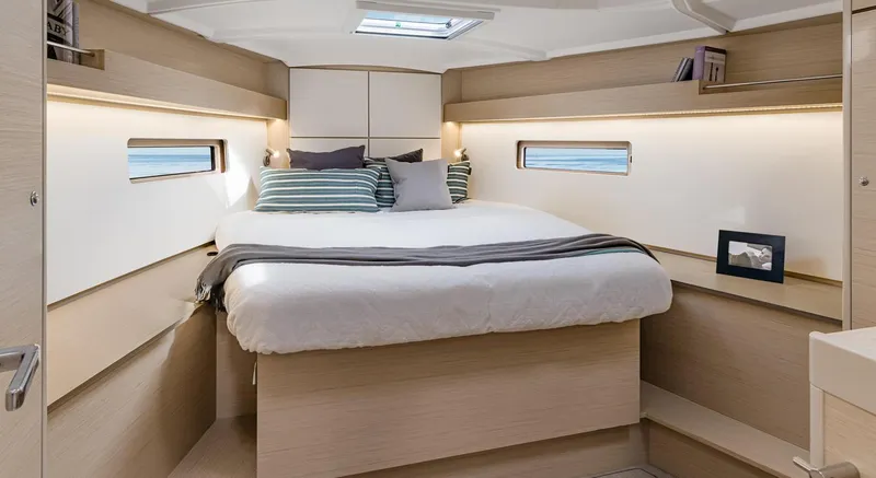 Slide: The Image of Luxurious cabin interior of 2026 Beneteau Oceanis 40.1 yacht with cozy bedding. - 6