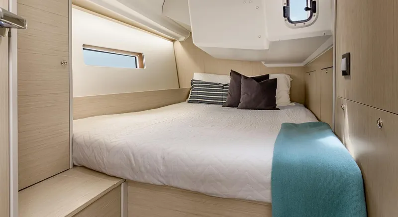 Slide: The Image of 2026 Beneteau Oceanis 40.1 cabin interior with cozy bed and modern design. - 7