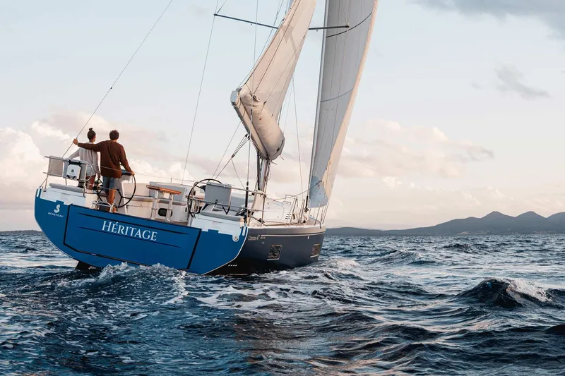 Slide: The Image of Beneteau Oceanis 47 sailboat, 2027 model, sailing on open sea. - 10