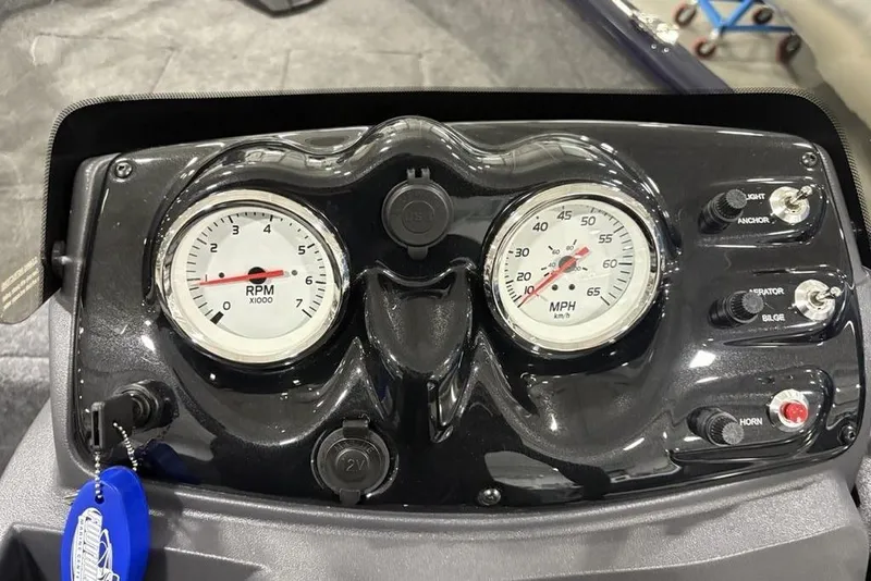 Slide: The Image of Dashboard of 2026 Tracker Super Guide V-16 SC boat with RPM and speed gauges. - 10