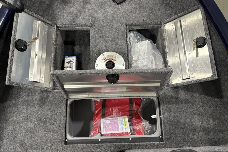 Slide: The Image of Interior compartments of 2026 Tracker Super Guide V-16 SC boat, featuring storage and safety equipment. - 11