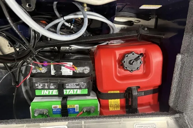 Slide: The Image of Battery and fuel tank setup in 2026 Tracker Super Guide V-16 SC boat. - 21