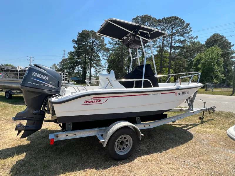 Slide: The Image of 2004 Boston Whaler 160 Dauntless boat on trailer with Yamaha engine. - 1