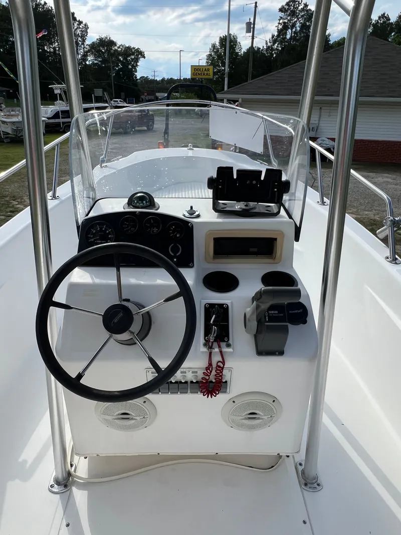 Slide: The Image of Steering console of a 2004 Boston Whaler 160 Dauntless boat. - 11