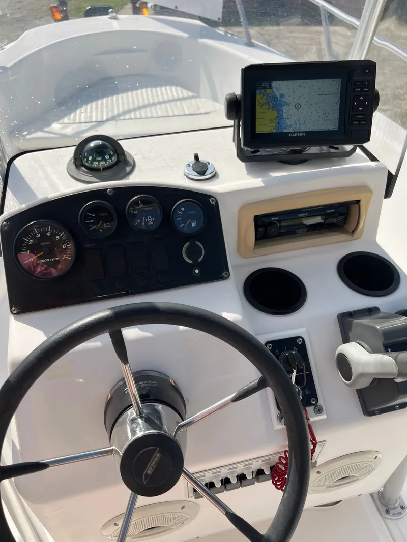 Slide: The Image of 2004 Boston Whaler 160 Dauntless helm with navigation system. - 12