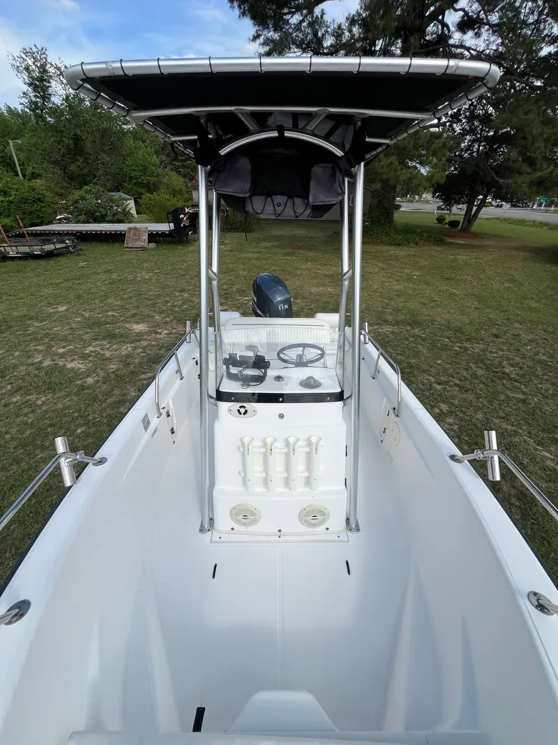 Slide: The Image of 2004 Boston Whaler 160 Dauntless boat with console and T-top. - 14