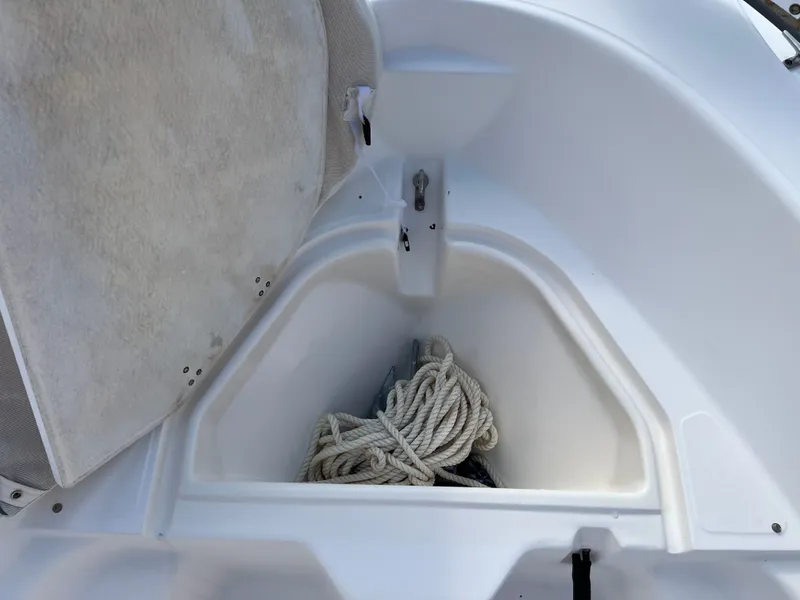 Slide: The Image of Storage compartment in 2004 Boston Whaler 160 Dauntless with rope. - 15