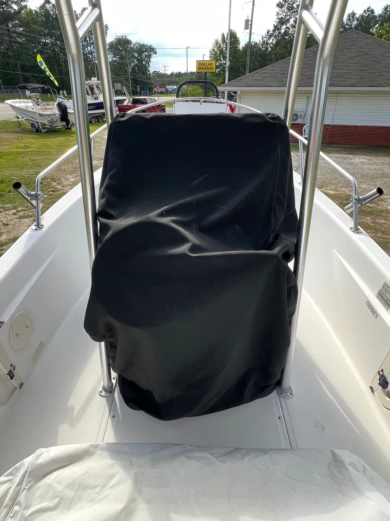 Slide: The Image of 2004 Boston Whaler 160 Dauntless with covered helm station. - 18
