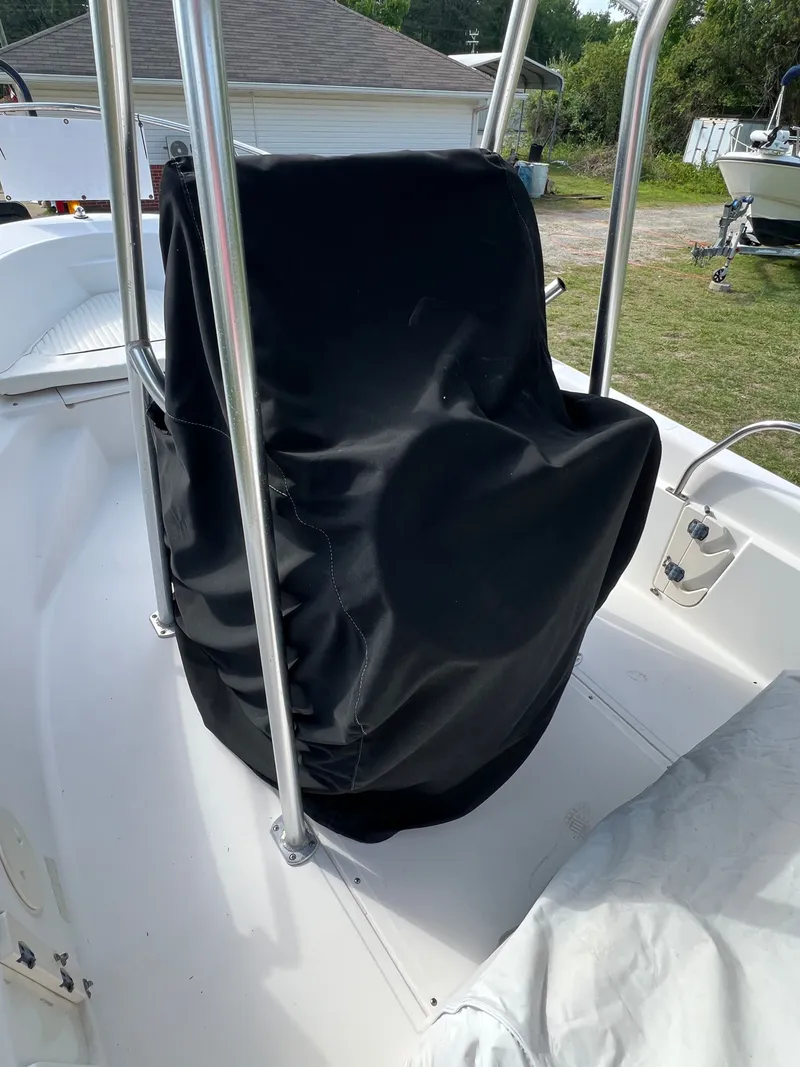 Slide: The Image of Covered seat on a 2004 Boston Whaler 160 Dauntless boat. - 19