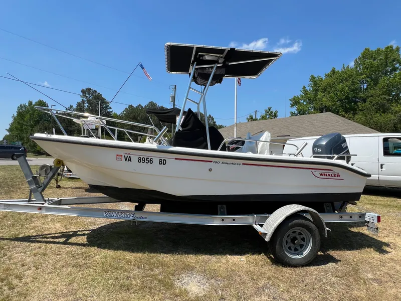 Slide: The Image of 2004 Boston Whaler 160 Dauntless on trailer, side view. - 2