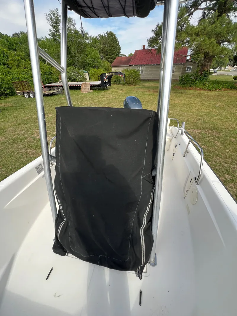 Slide: The Image of Boston Whaler 160 Dauntless 2004 with cover outdoors. - 20
