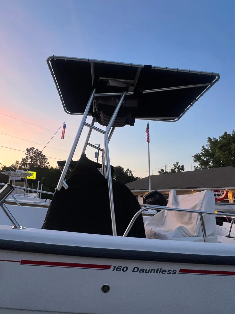 Slide: The Image of 2004 Boston Whaler 160 Dauntless with T-top at sunset. - 4