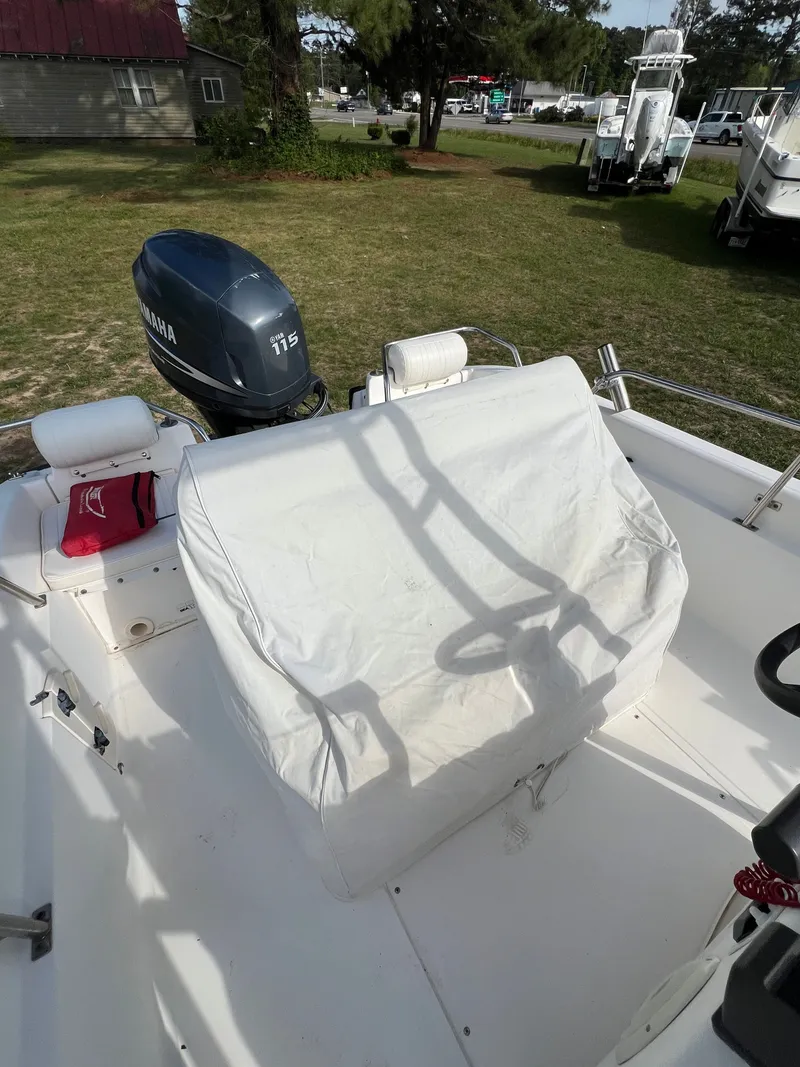 Slide: The Image of 2004 Boston Whaler 160 Dauntless with Yamaha 115 engine, covered. - 9