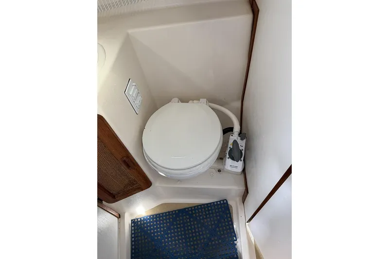 Slide: The Image of Compact marine toilet in 1995 Com-Pac 25 sailboat bathroom. - 17