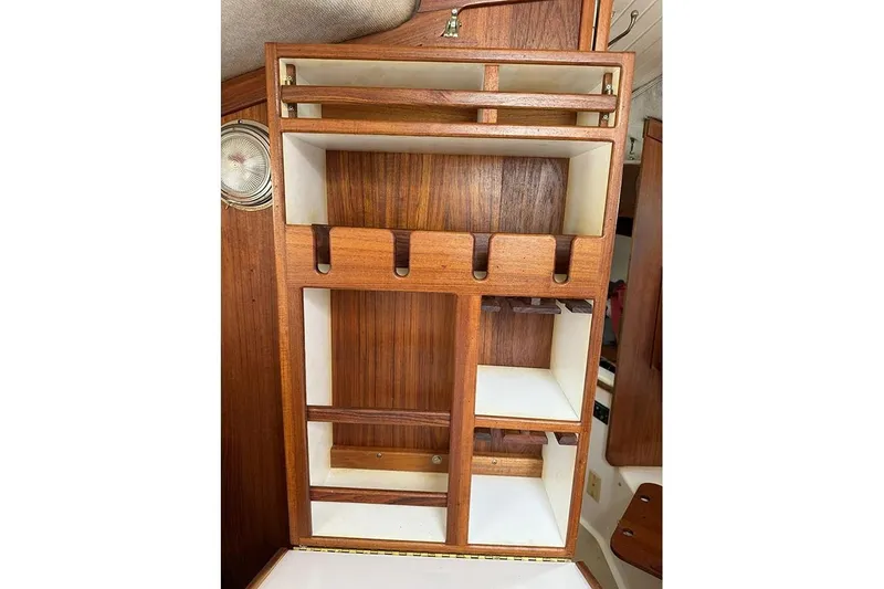 Slide: The Image of Interior wooden storage compartments on a 1995 Com-Pac 25 sailboat. - 7