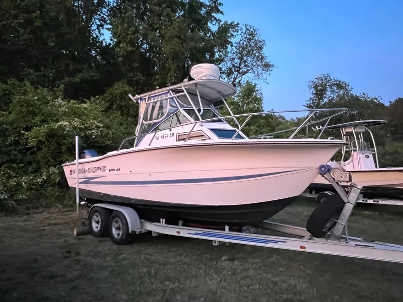 Slide: The Image of 1990 Hydra-Sports 2200 WA boat on trailer outdoors. - 2