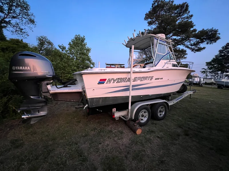 Slide: The Image of 1990 Hydra-Sports 2200 WA boat on trailer outdoors. - 3