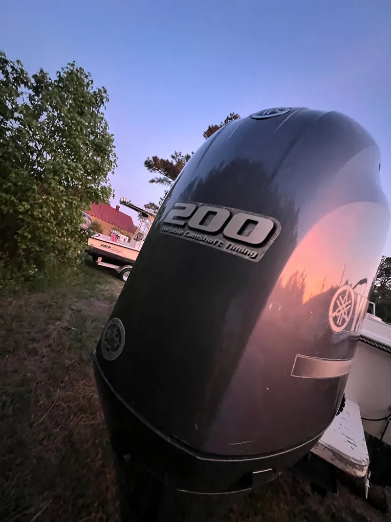 Slide: The Image of Outboard motor of a 1990 Hydra-Sports 2200 WA at sunset. - 4