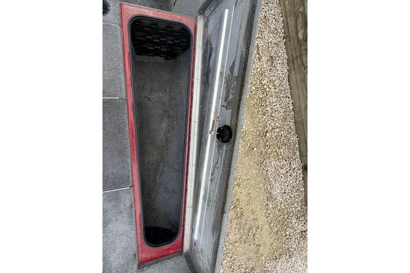Slide: The Image of Open storage compartment on 2021 Tracker Pro Team 195 TXW boat. - 11