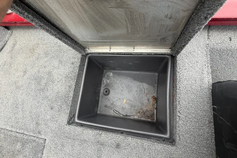 Slide: The Image of Open storage compartment on 2021 Tracker Pro Team 195 TXW boat. - 16