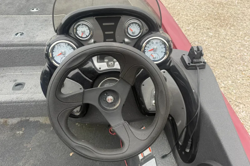 Slide: The Image of Steering console of 2021 Tracker Pro Team 195 TXW boat with gauges. - 19