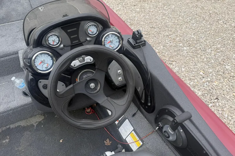 Slide: The Image of 2021 Tracker Pro Team 195 TXW boat dashboard with steering wheel and gauges. - 20