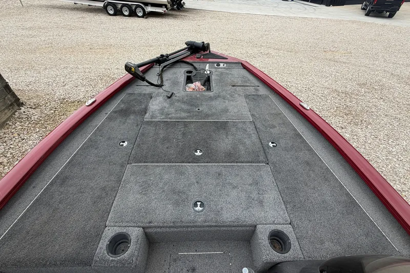 Slide: The Image of 2021 Tracker Pro Team 195 TXW boat deck with red trim and fishing equipment. - 22
