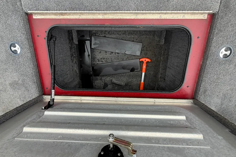 Slide: The Image of Open storage compartment in 2021 Tracker Pro Team 195 TXW boat. - 9