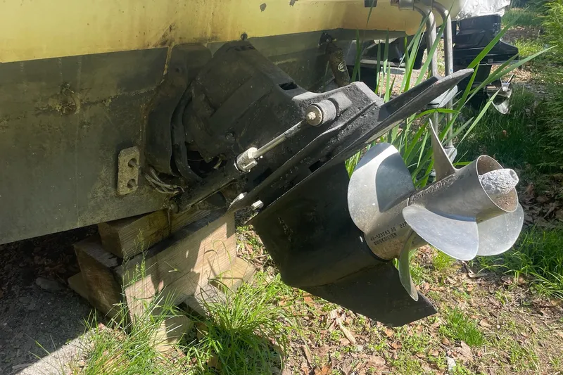 Slide: The Image of 2002 Maxum 2700 SCR boat propeller and stern drive on wooden blocks. - 17