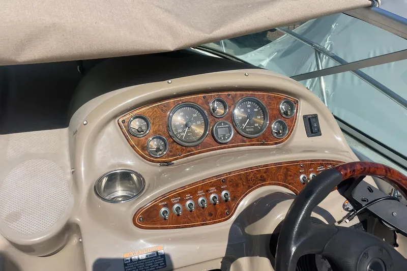 Slide: The Image of Dashboard of a 2002 Maxum 2700 SCR boat with gauges and controls. - 5