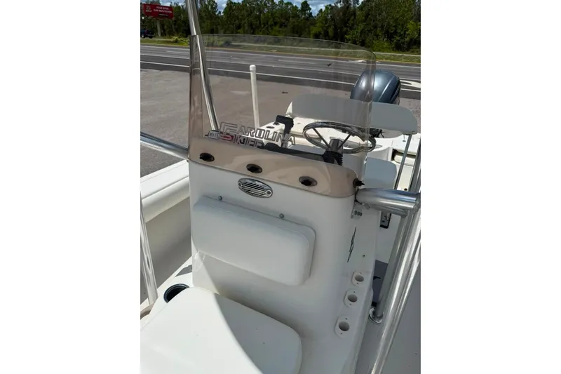 Slide: The Image of 2016 Sea Chaser 21 Sea Skiff boat console with steering wheel and windshield. - 10