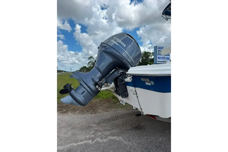 Slide: The Image of 2016 Sea Chaser 21 Sea Skiff with Yamaha outboard motor on a trailer. - 5