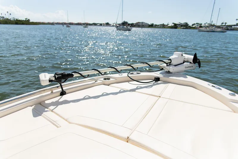 Slide: The Image of 2024 Grady-White 231 Coastal Explorer boat with Garmin equipment on calm water. - 10