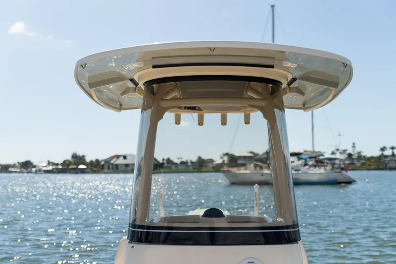 Slide: The Image of 2024 Grady-White 231 Coastal Explorer boat on sunny waterfront. - 16