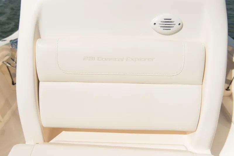 Slide: The Image of 2024 Grady-White 231 Coastal Explorer boat seat detail with embossed model name. - 17
