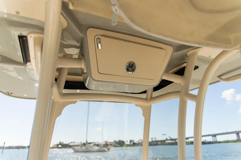 Slide: The Image of 2024 Grady-White 231 Coastal Explorer boat interior with storage compartment. - 22