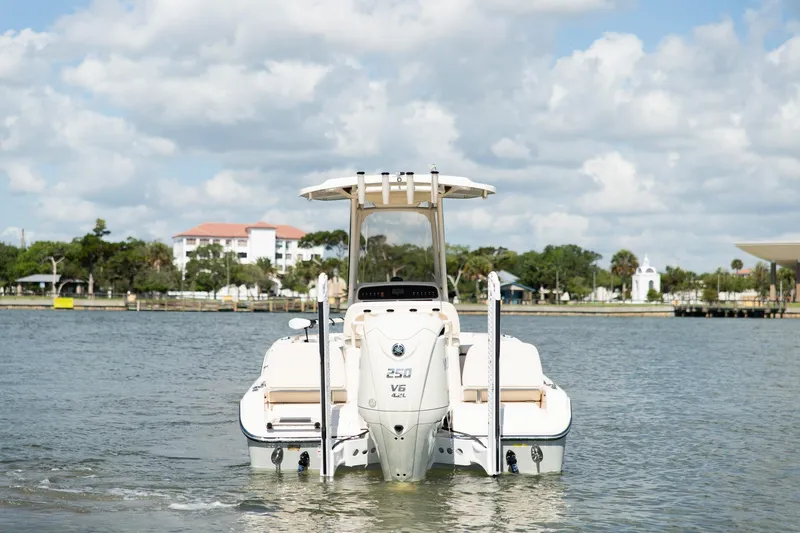 Slide: The Image of 2024 Grady-White 231 Coastal Explorer boat on calm water, scenic background. - 4