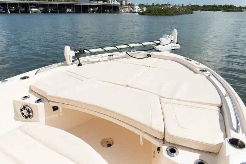 Slide: The Image of 2024 Grady-White 231 Coastal Explorer boat with cushioned seating and Garmin equipment. - 8