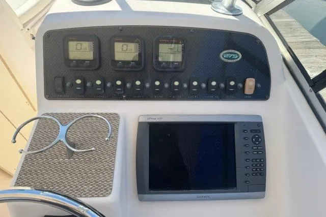 Slide: The Image of Control panel of 2012 Grady-White Freedom 275 boat with Garmin navigation system. - 19