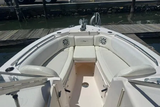 Slide: The Image of 2012 Grady-White Freedom 275 boat with spacious seating and sleek design at dock. - 23