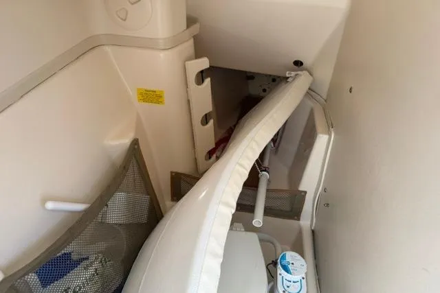 Slide: The Image of Interior cabin of 2012 Grady-White Freedom 275 boat, featuring storage and seating. - 27