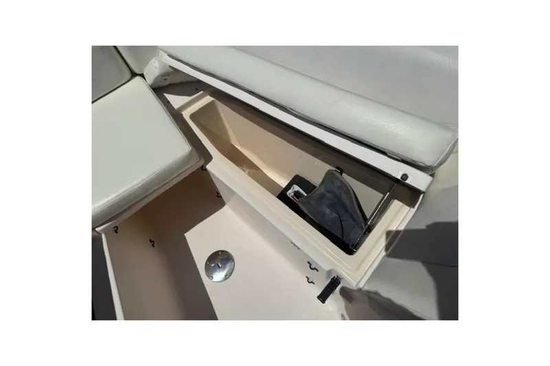 Slide: The Image of Storage compartment on a 2012 Grady-White Freedom 275 boat, featuring cushioned seating. - 28