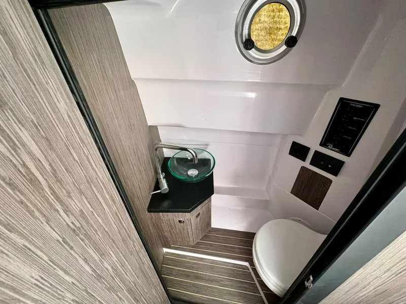 Slide: The Image of Modern bathroom in 2025 Ranieri CAYMAN 28 EXECUTIVE boat with sink and toilet. - 24