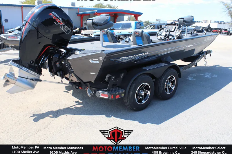 Slide: The Image of 2020 Ranger RT198P boat with Mercury Pro XS engine on trailer, displayed outdoors. - 2