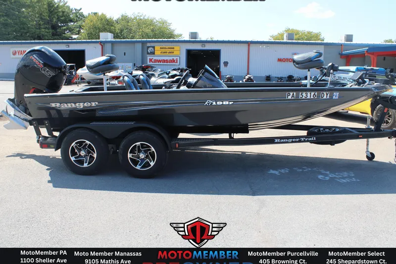 Slide: The Image of 2020 Ranger RT198P boat on trailer at dealership, featuring sleek design and powerful motor. - 3